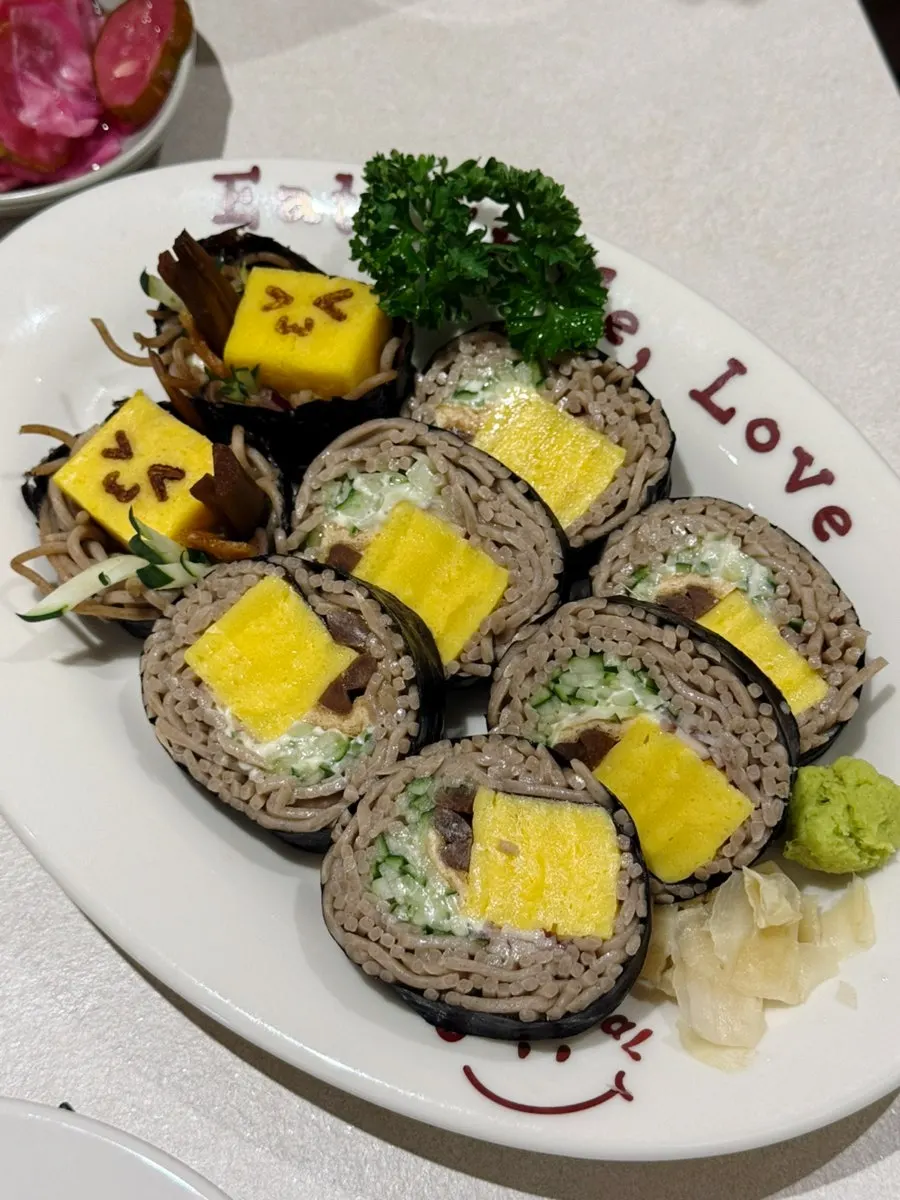 Buckwheat soba maki with a face drawn in egg