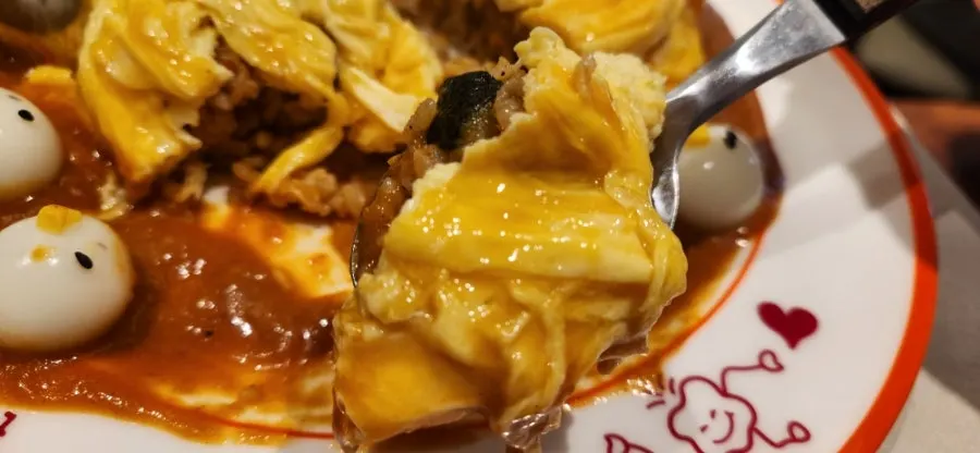 Rubber duck omurice sliced cleanly with a knife
