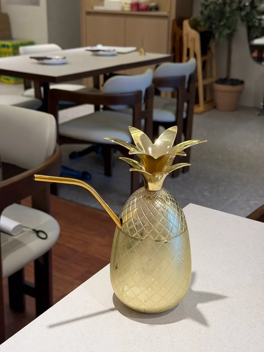 Oh! Pineapple Ade served in a pineapple-shaped cup