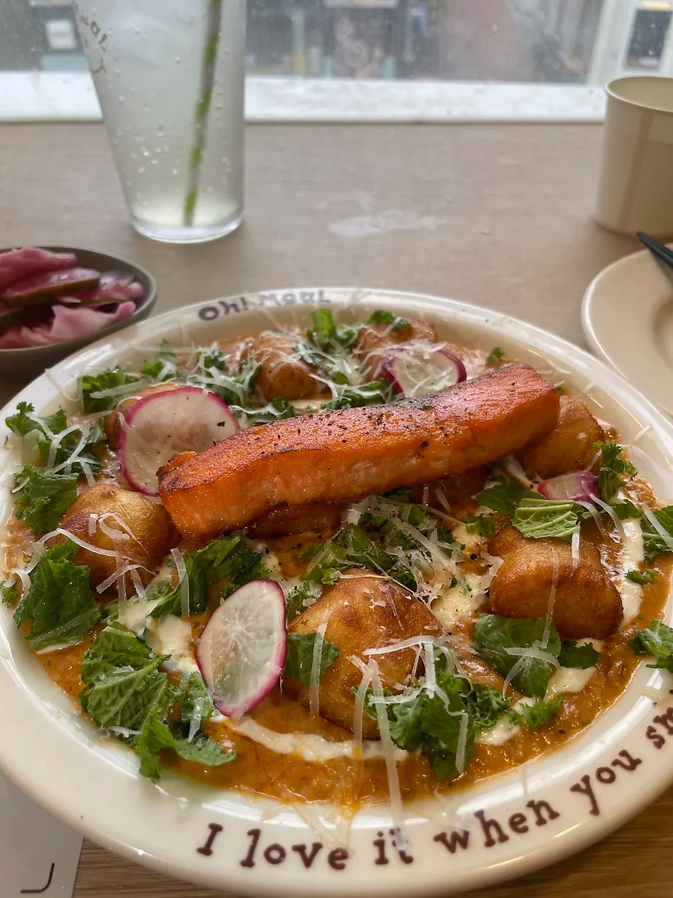 A plate of the ordered salmon steak gnocchi