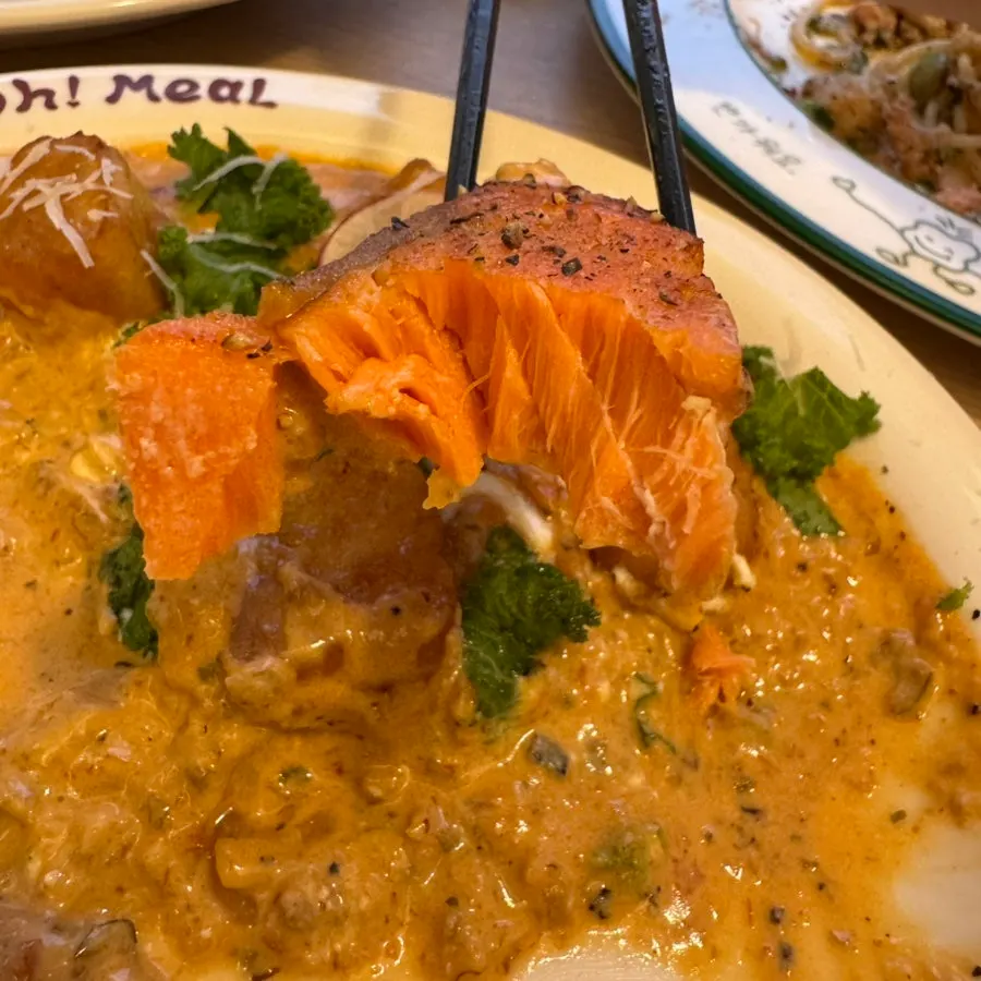 Plate of gnocchi topped with plump salmon