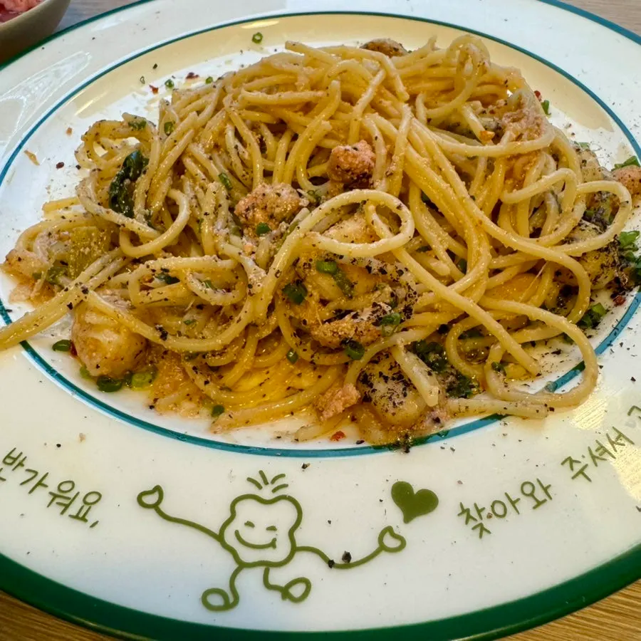 Close-up of oil pasta loaded with cod roe