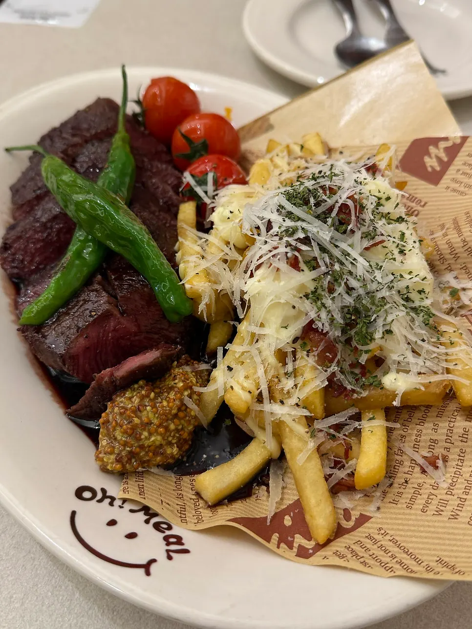 Plate of Omil Steak served with french fries