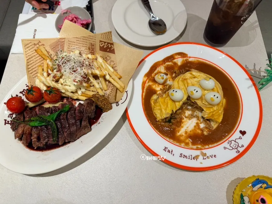 Table spread of Omil Steak and rubber duck omurice