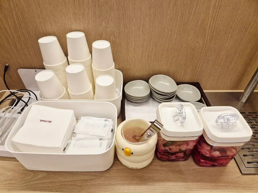 Self-service bar with water and pickles