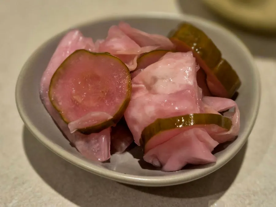 Small dish of crisp pickles brought to the table