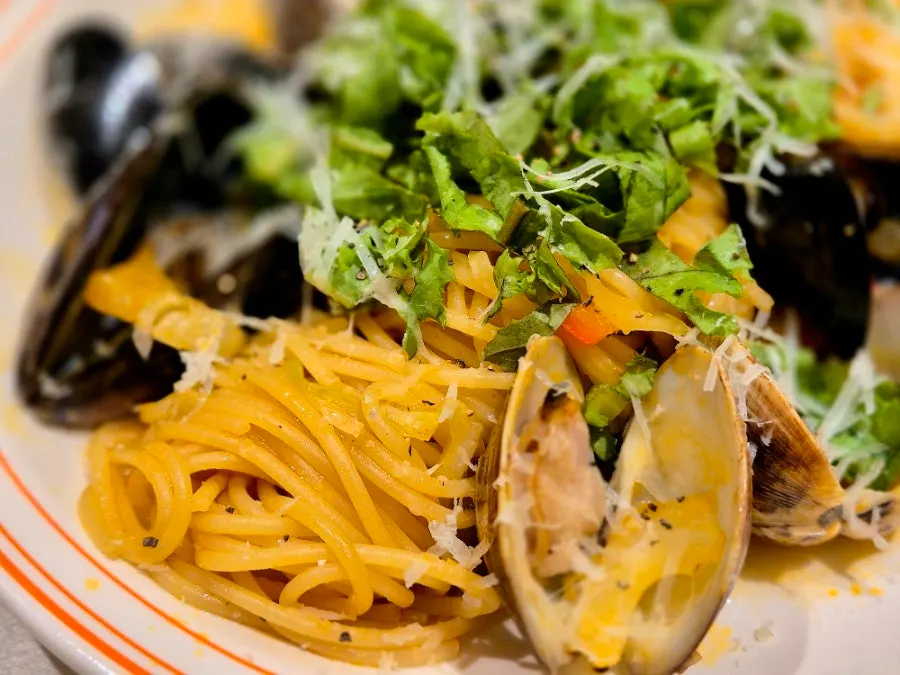 Spicy seafood pasta topped with mussels and squid