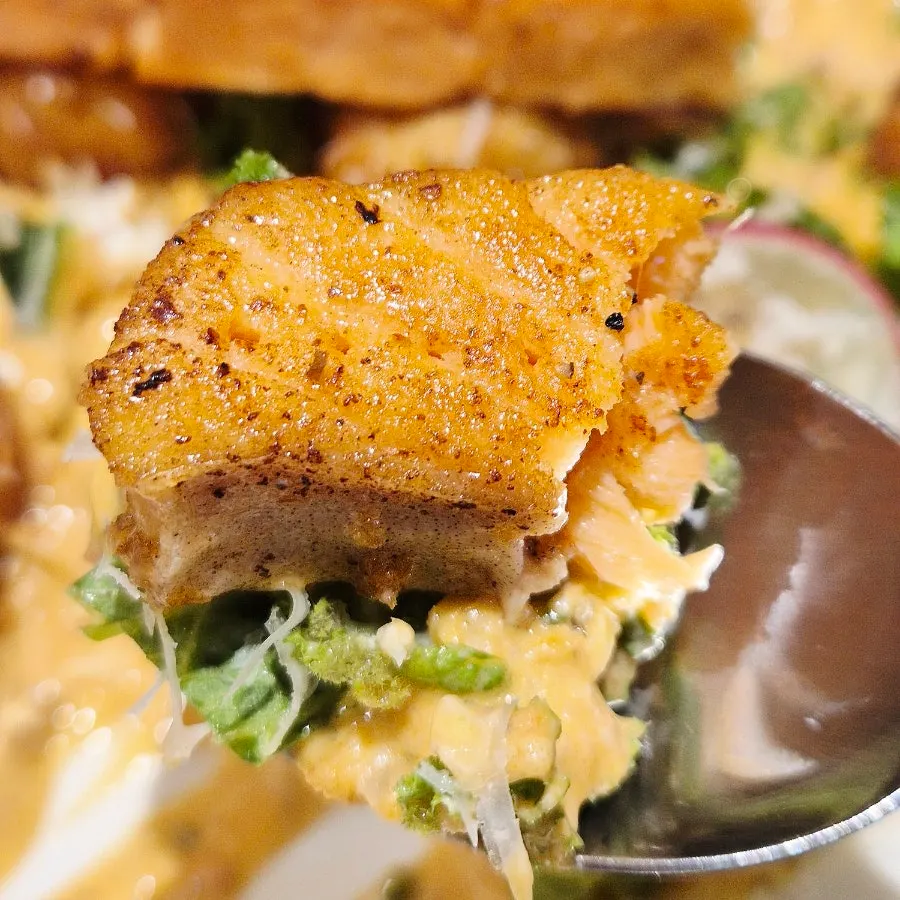 Chewy handmade gnocchi next to a thick cross-section of salmon