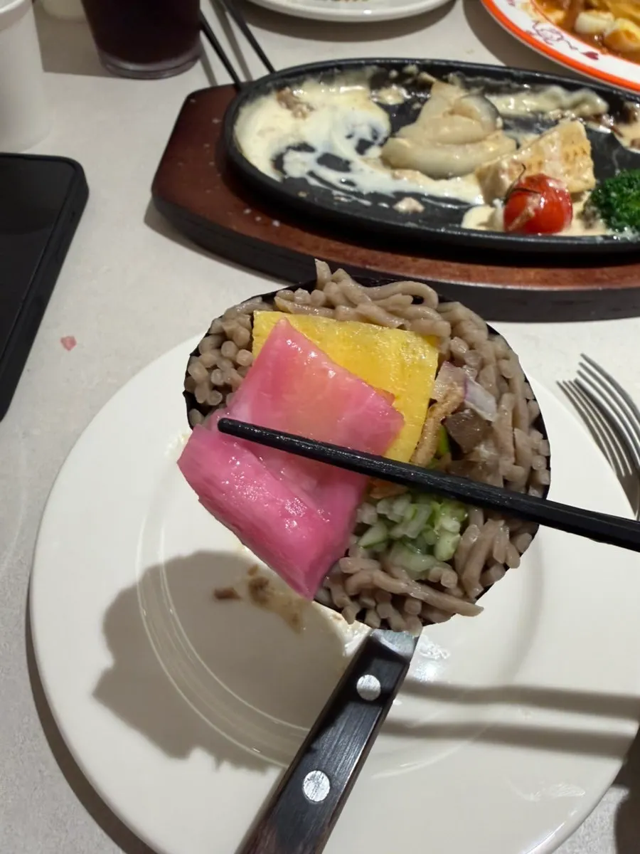 A piece of cheese katsu with the cheese stretching