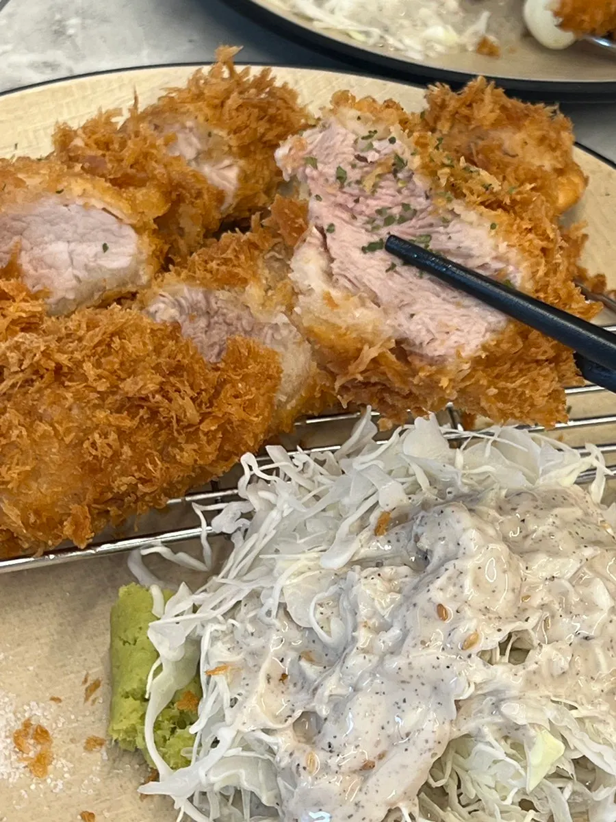 Cross-section of tenderloin katsu showing moist meat grain