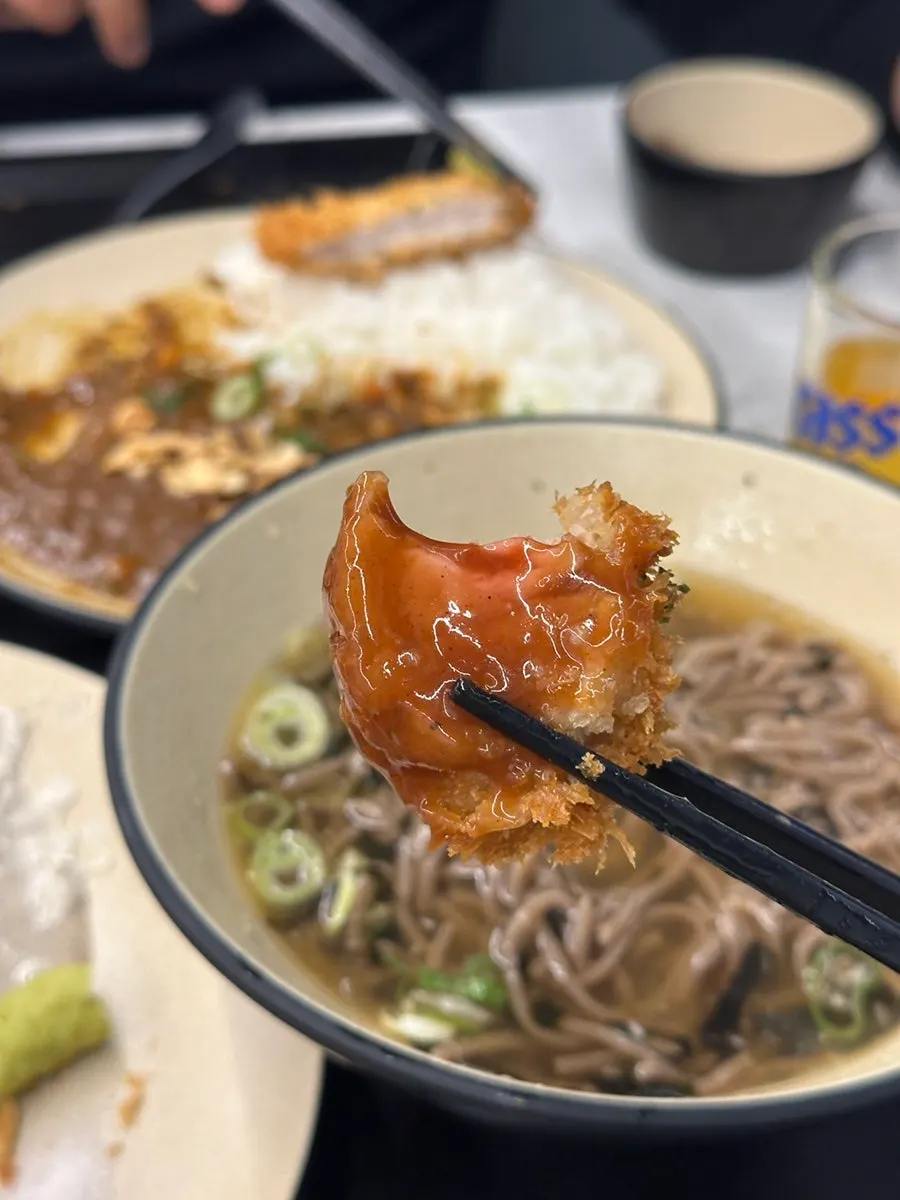 Empty bowls after finishing the meal at Omi Katsu