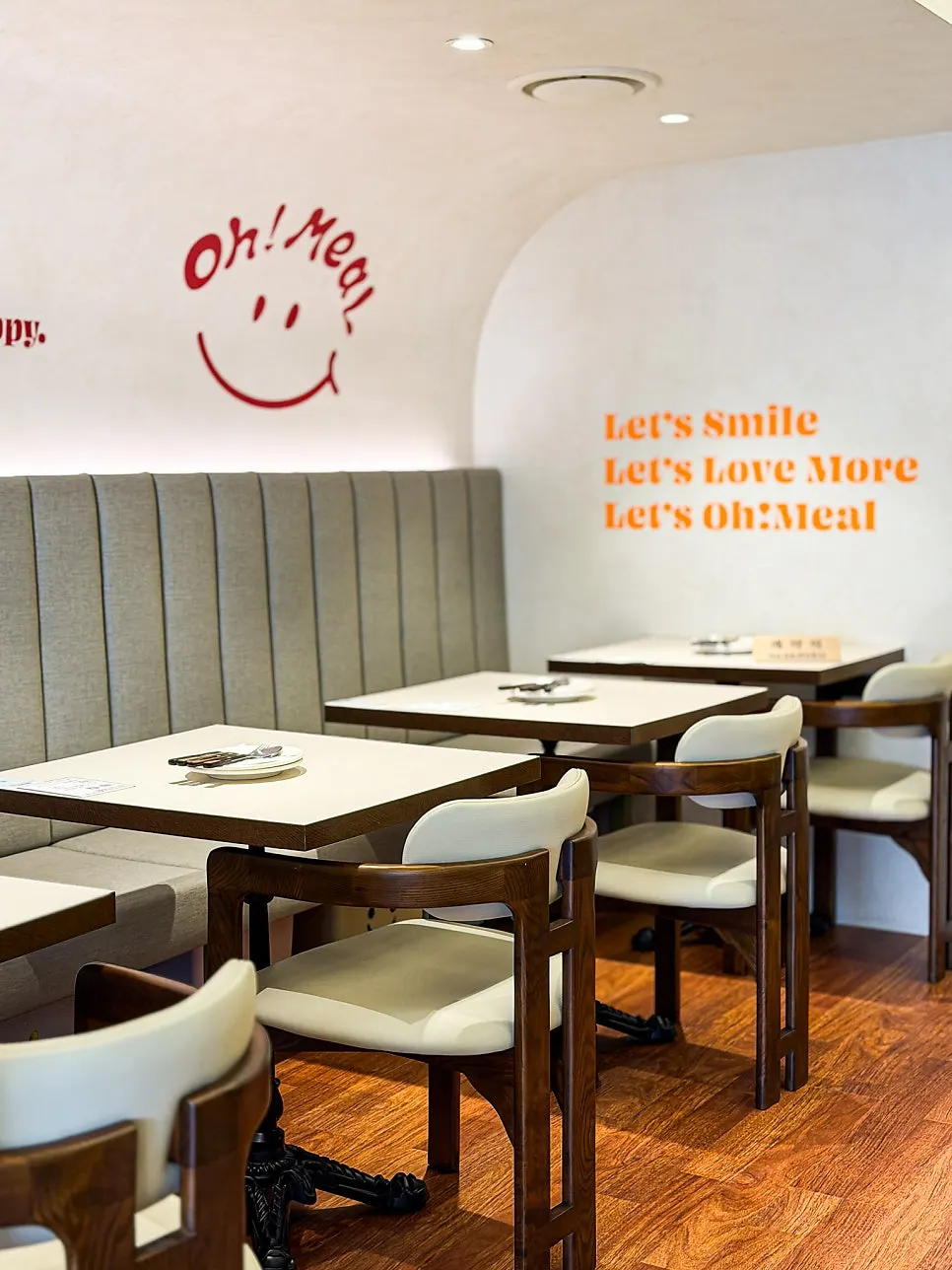 Bright, warm-toned interior of Omil Hyehwa Daehangno