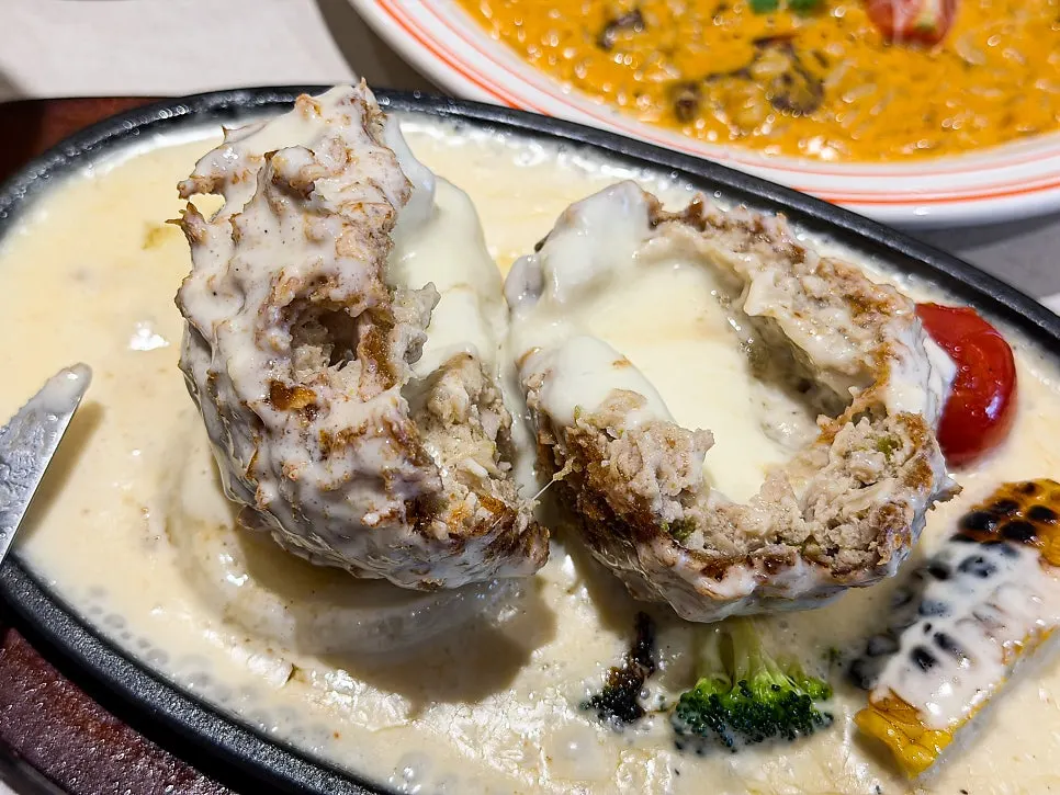 Stretchy melted cheese pulling from the cheese katsu