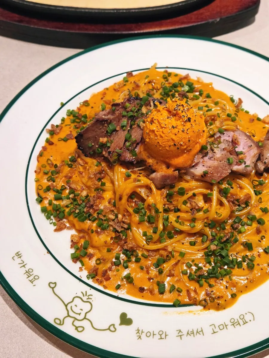 Pasta topped with sous-vide pork shoulder and gochujang butter mousse