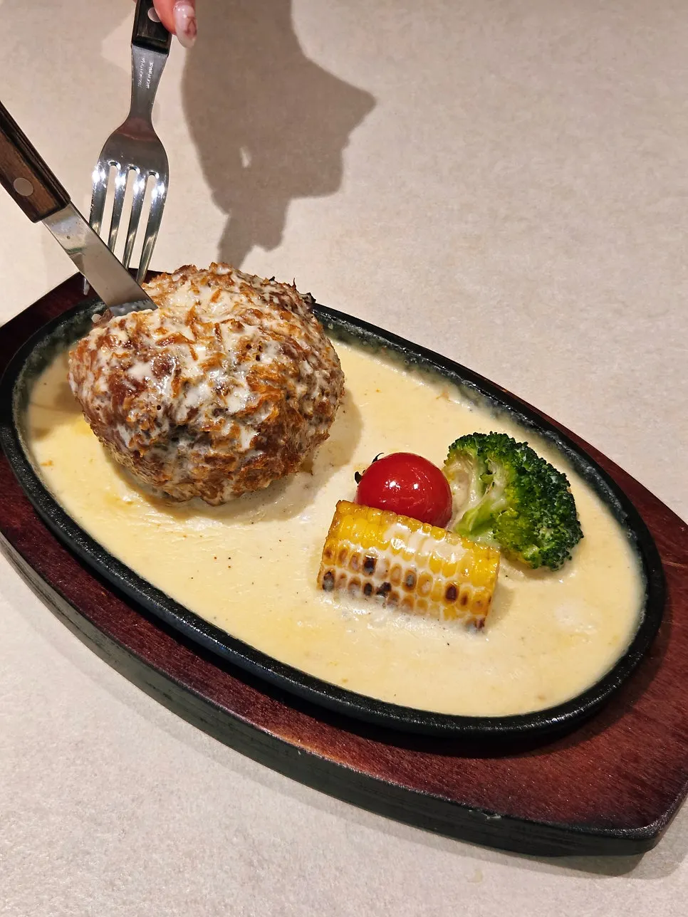 The full cheese katsu covered in melted cheese