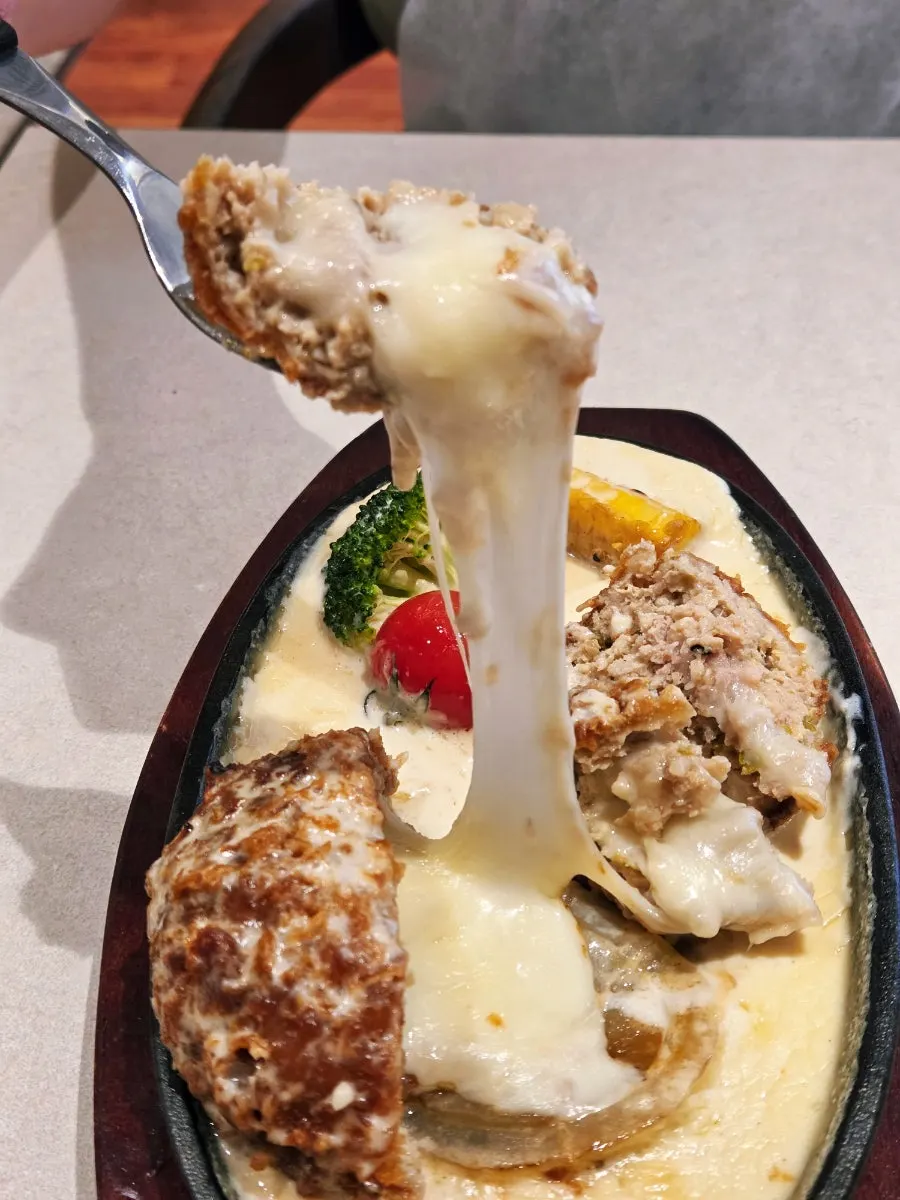 Mozzarella cheese flowing out like a waterfall