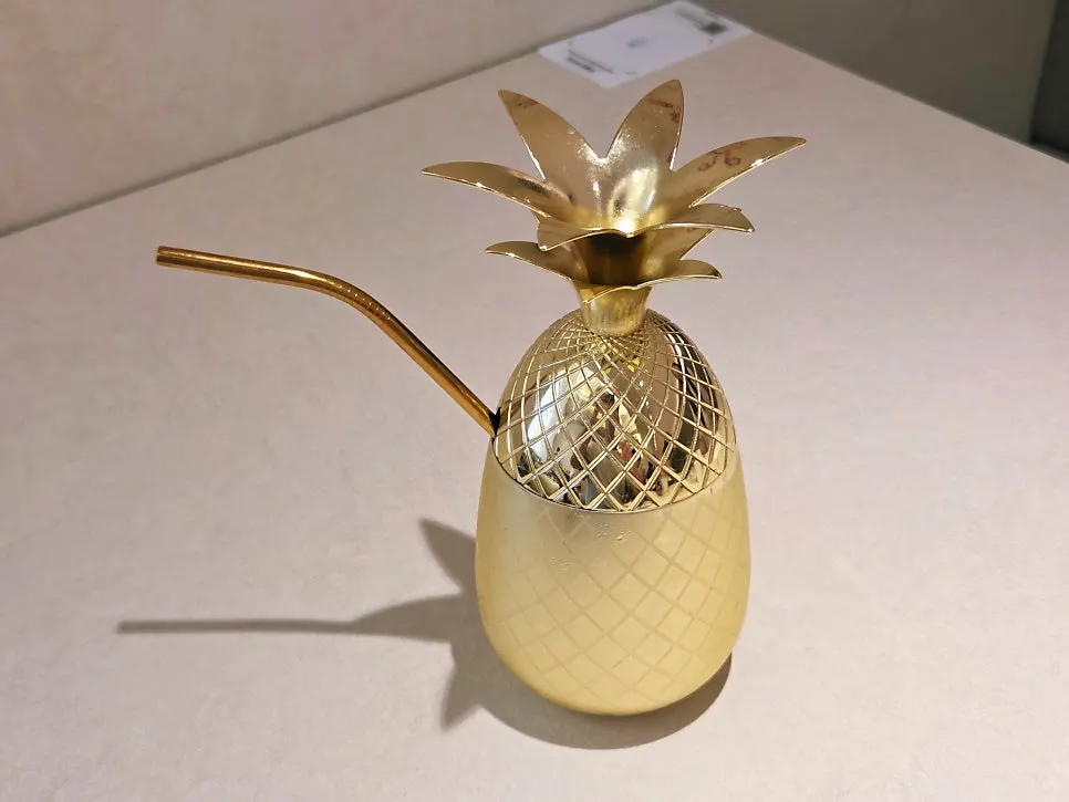 Pineapple ade served in a pineapple-shaped cup