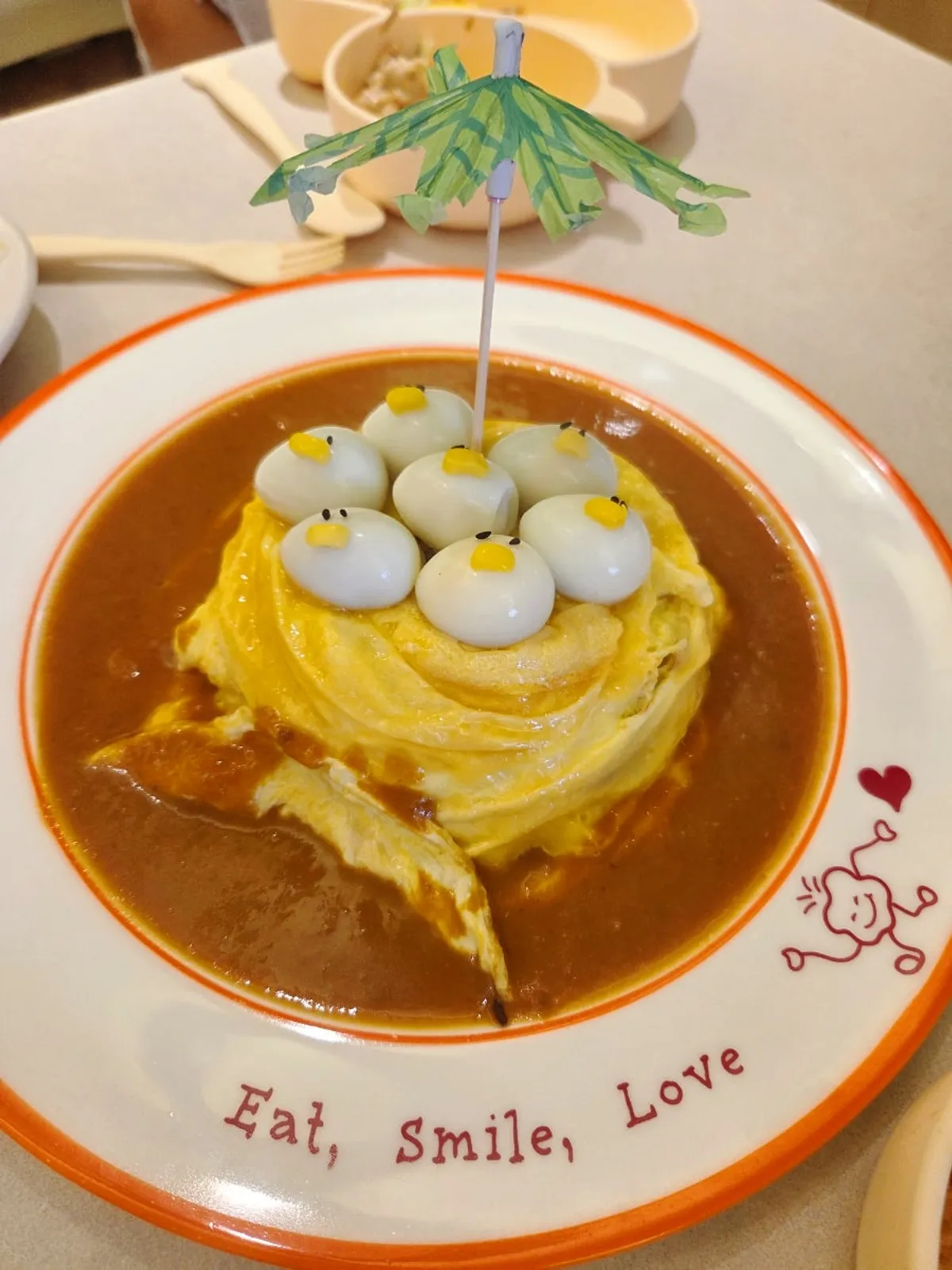 Yellow rubber-duck omurice topped with a rubber duck