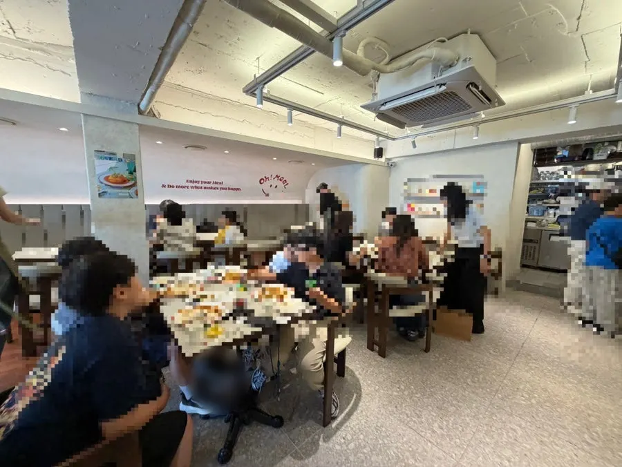 Tables inside Omil packed with customers