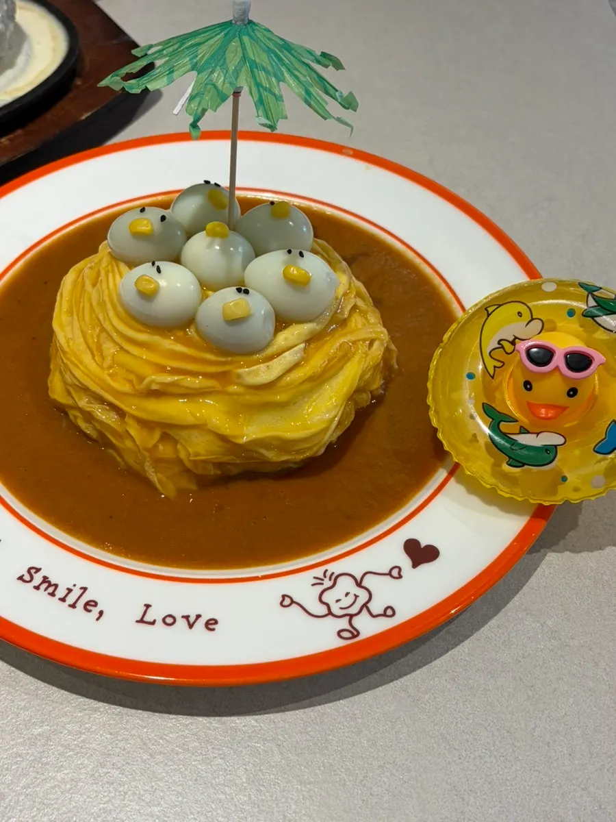 Free rubber-duck plush next to the omurice