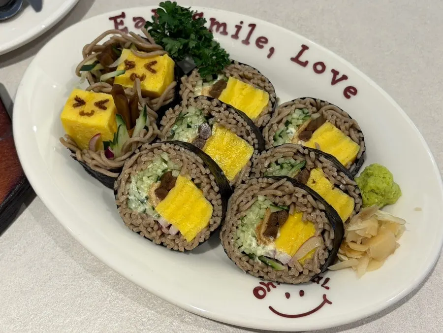 Soba noodles and rolled egg wrapped into maki
