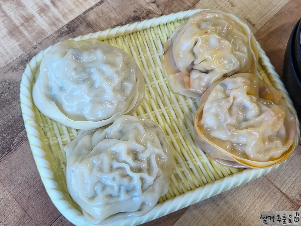 Fist-sized handmade steamed dumplings served first