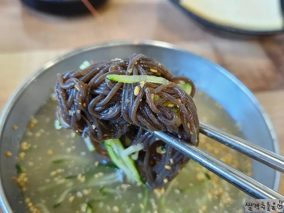 An empty naengmyeon bowl after finishing the meal