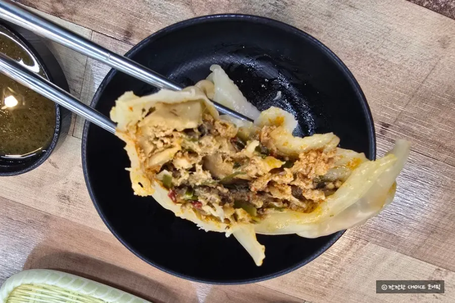 Steamed dumpling split in half showing the filling
