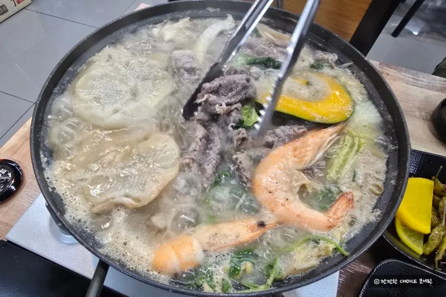 Hot pot ingredients cooking in the nutty perilla broth