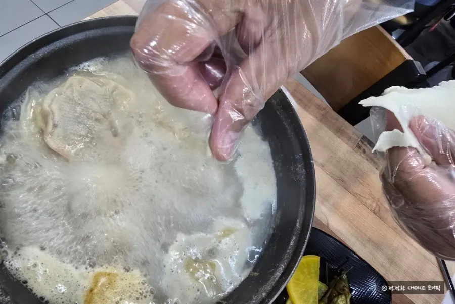 Sujebi noodles added to the remaining hot pot broth
