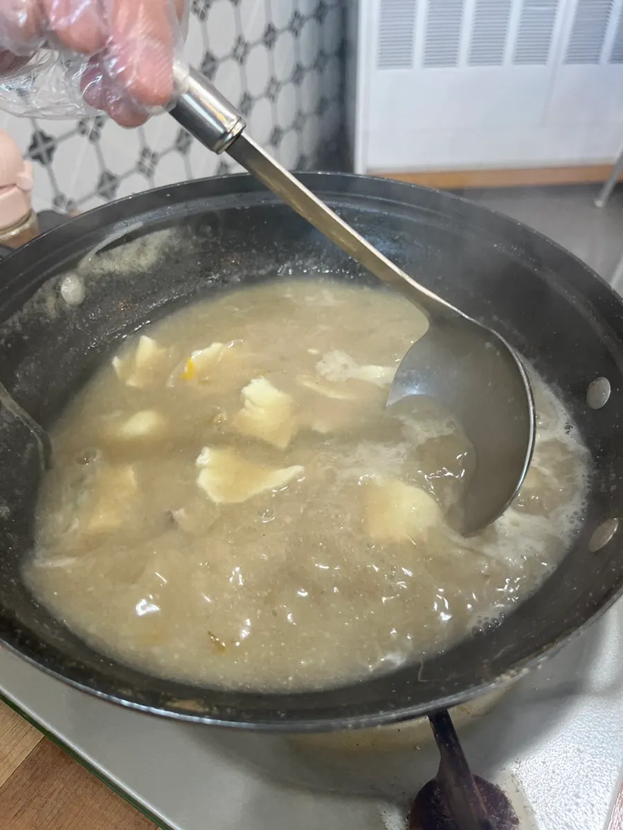 Self-serve bar with sujebi and ramyeon noodles ready to add