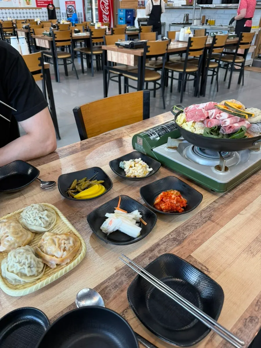 Pot full of vegetables and dumplings in the hot pot