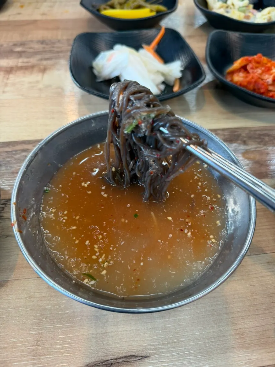 A small three-bite portion of dessert cold noodle soup