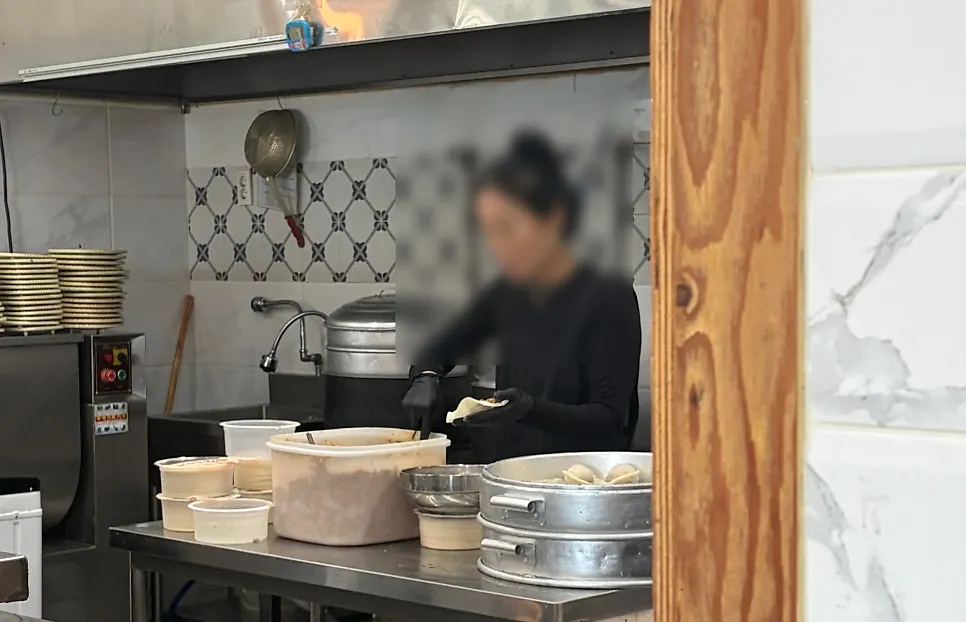 Hand-pinching dumplings in the kitchen