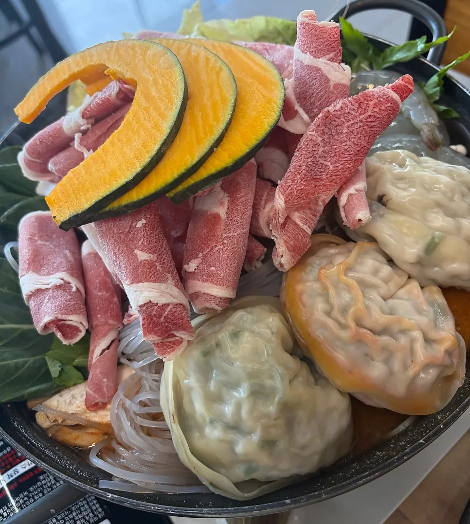 Spicy dumpling hot pot simmering