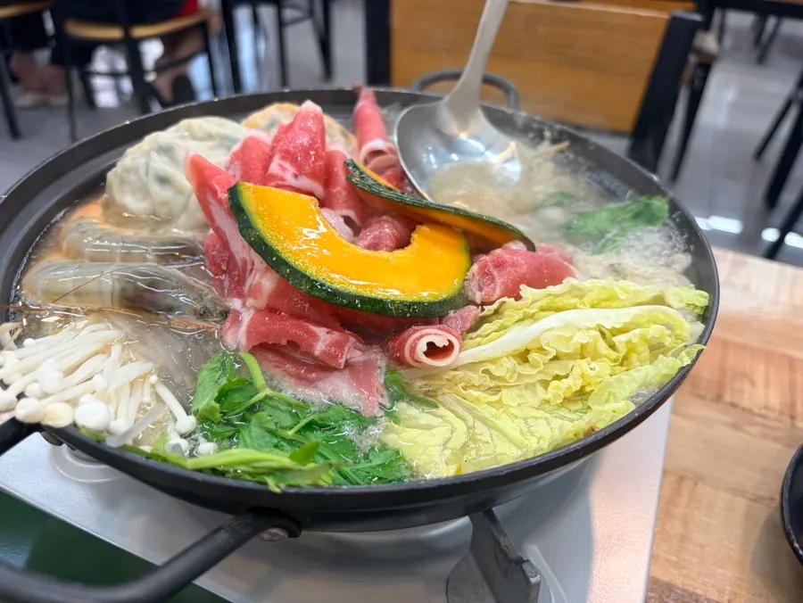 Broth starting to boil in the dumpling hot pot