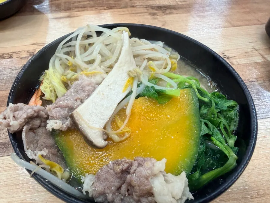 Close-up of the deeply flavored hot pot broth