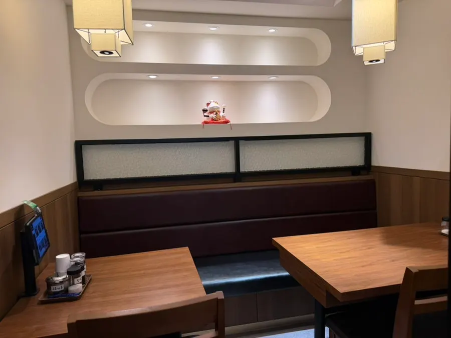 Spacious, clean interior dining hall of the Chinese restaurant