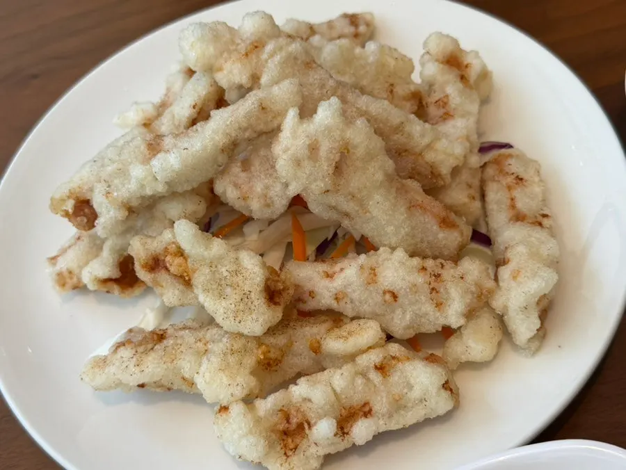 A plate of golden fried dumplings