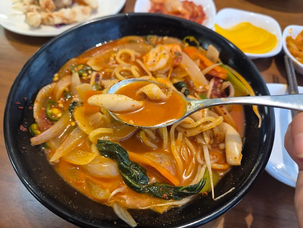 Jjampong broth showing plenty of seafood