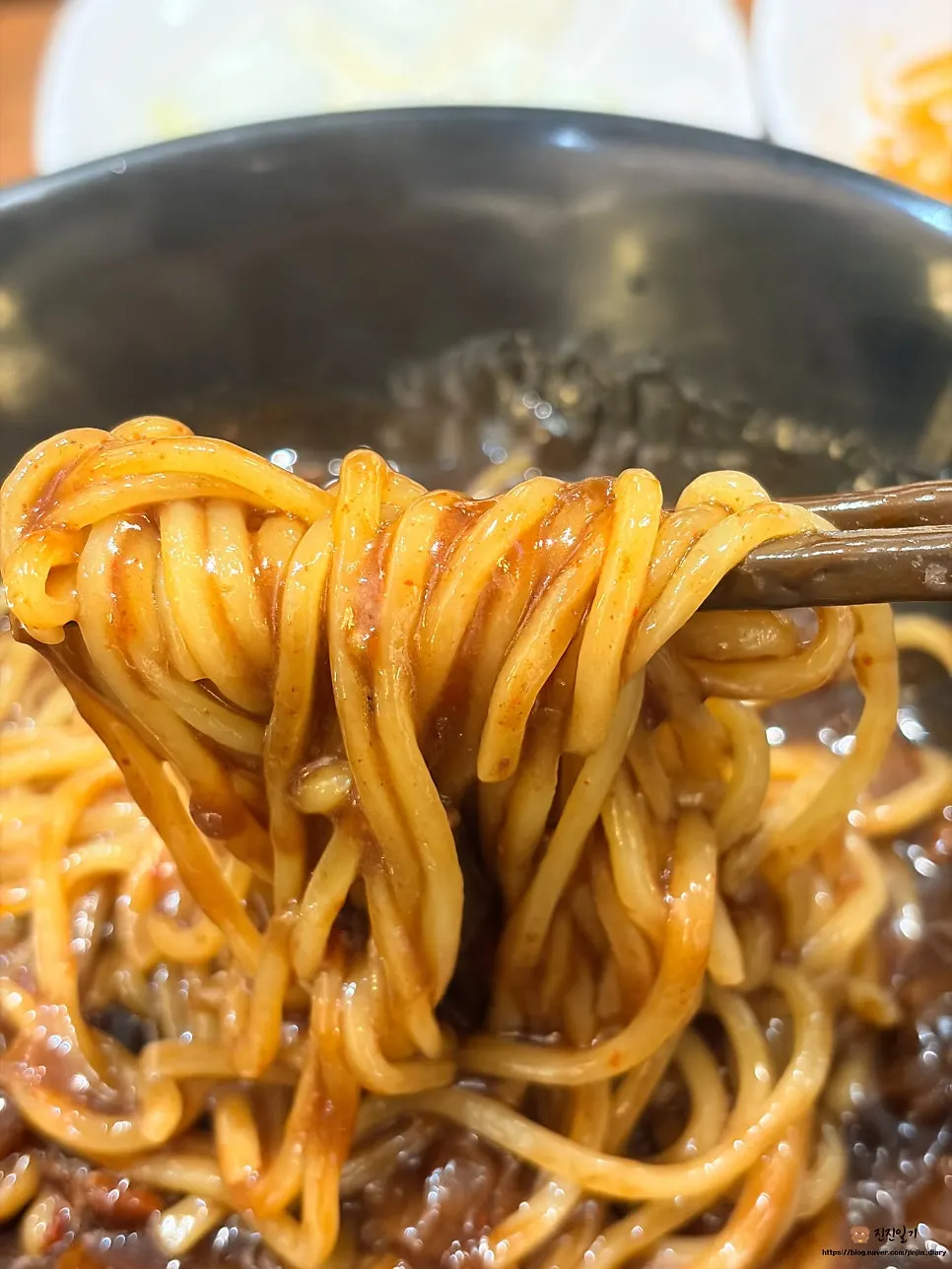 Jjajangmyeon noodles mixed with chili flakes