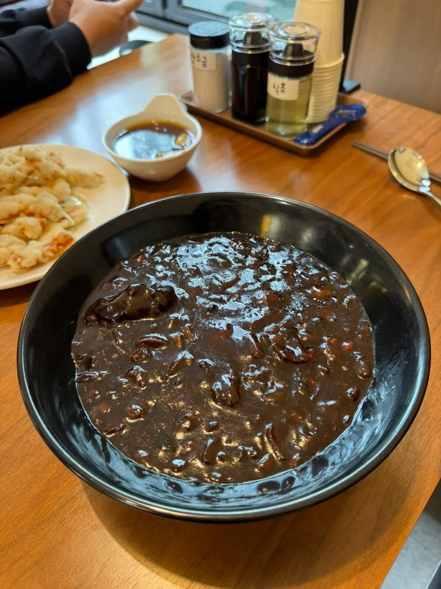 Noodles topped with glossy jjajang sauce