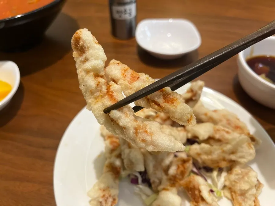 Tangsuyuk dipped in the sauce