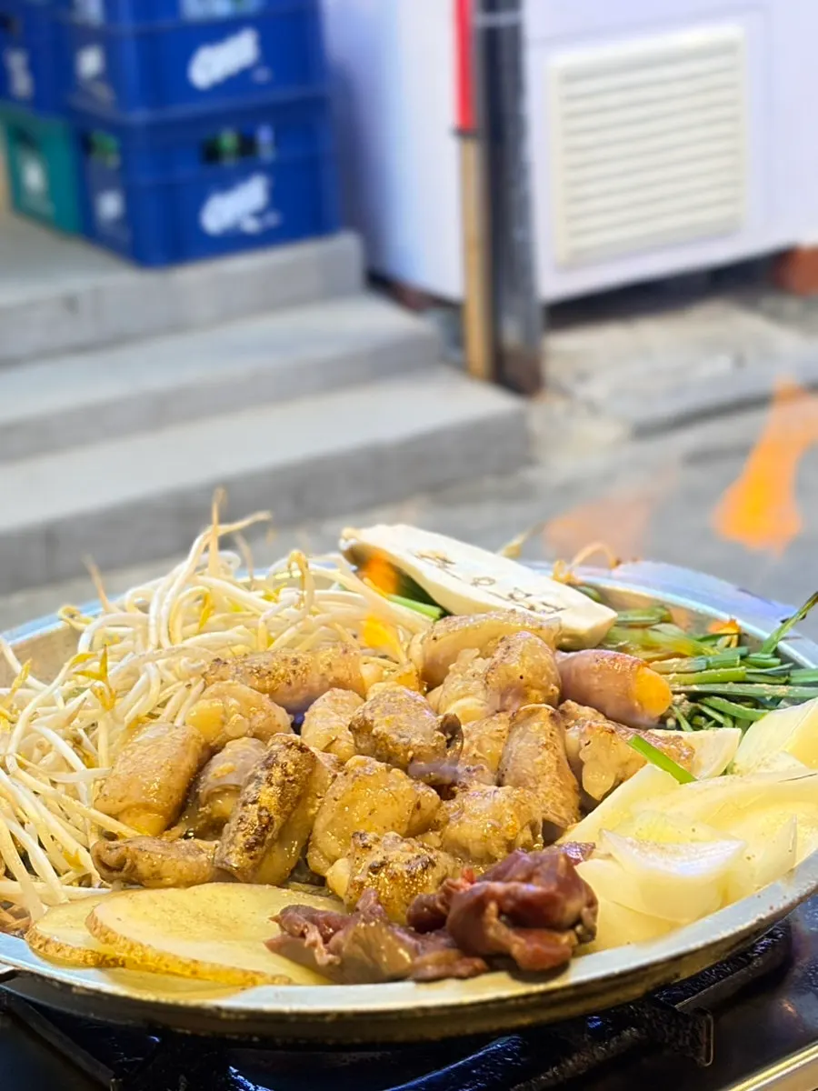 Traditional handmade garlic gopchang cooking on the grill