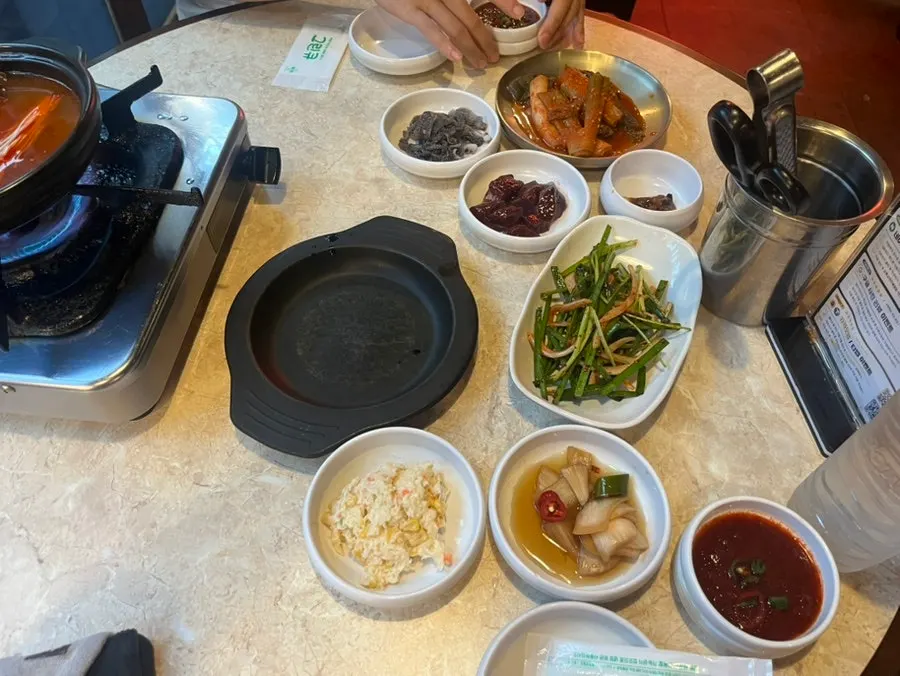Side dish spread with scallion kimchi, liver, and cheonyeop