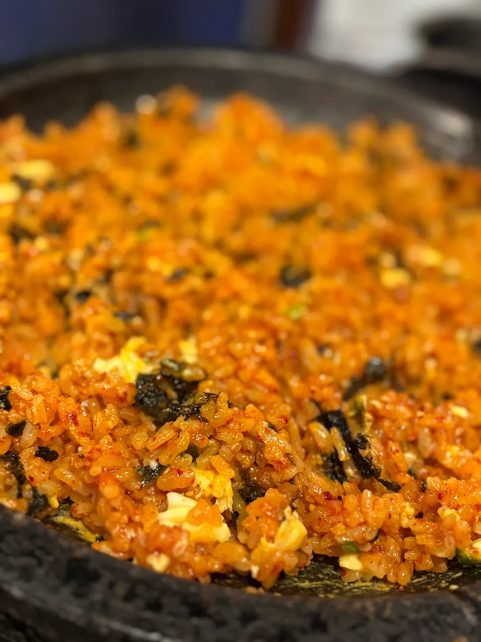 A spoonful of fried rice made with Korean beef fat