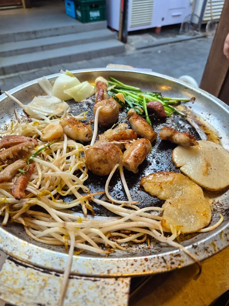The extra mixed gopchang cooking on the grill