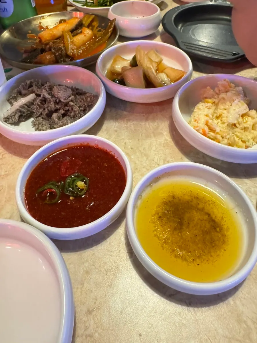 Full spread of Omokgyo Gopchang's side dishes