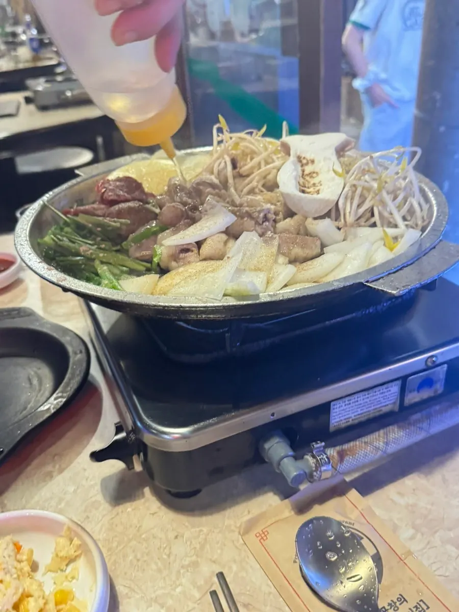 Traditional handmade garlic gopchang and hwangso gopchang on the grill