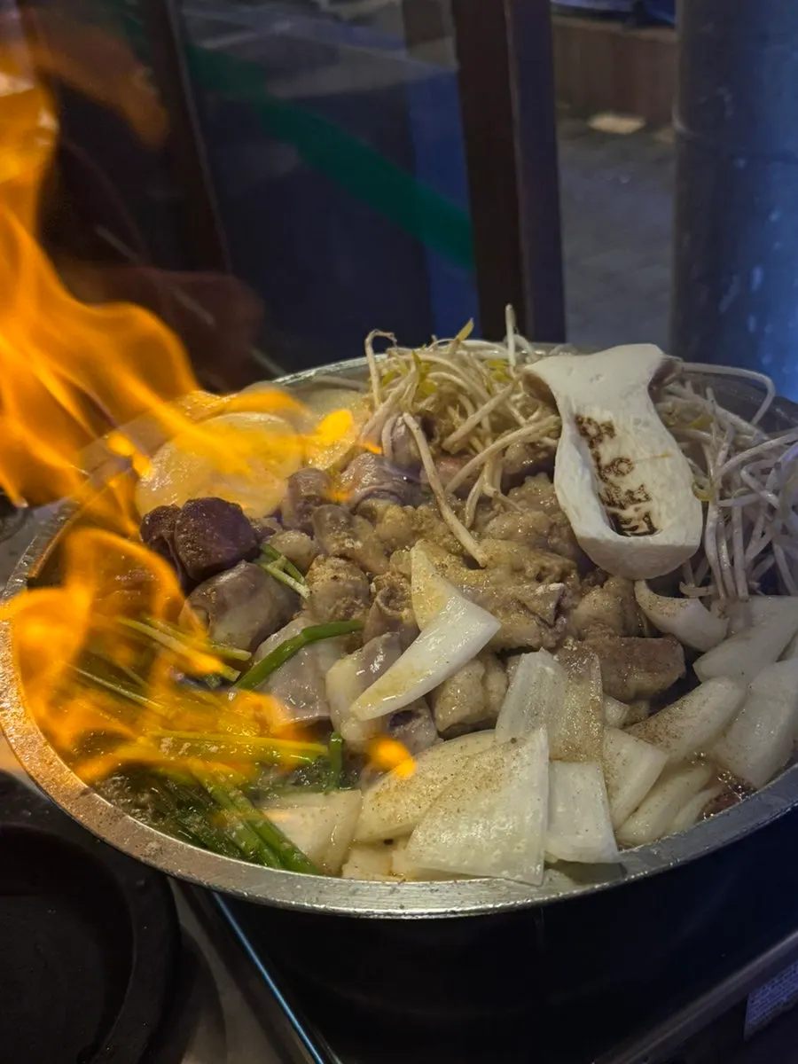 Flames rising from the gopchang grill